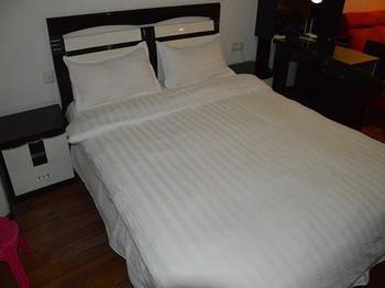 Yangguang Xingzuo Apartment Hotel Csungking Kültér fotó